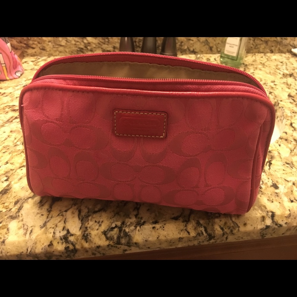 Hot pink Coach toiletry/ makeup bag